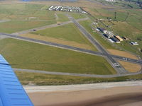 Caernarfon Airport, Caernarfon, Wales United Kingdom (EGCK) - Looking back at Caernarfon after departing from R/W 26 - by Chris Hall