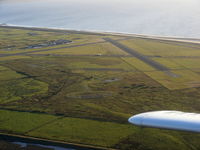 Airport - Looking back at Caernarfon after departing from R/W 26 - by Chris Hall