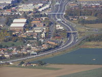 X7SE Airport - The old hangars at the former RAF Sealand site can be seen on the left of the main road - by Chris Hall