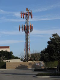 Oxnard Airport (OXR) - OXR's Airport Rotating Beacon (clear-green) with sector block to the OXR Air Traffic Control Tower, atop one of several antenna farms. Location: SE. White-red vertical antennas are cell phone repeaters. - by Doug Robertson