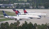 Orlando International Airport (MCO) - Five Delta planes hardstanding at Airside 2 as they ran out of hardstands at Airside 4 due to cancellations from Hurricane Irene - by Florida Metal