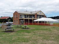 Tyabb Airport, Tyabb, Victoria Australia (YTYA) - Peninsula Aero Club building from another angle, showing barbeque area and preparations for the airshow on Sunday, March 4. - by red750