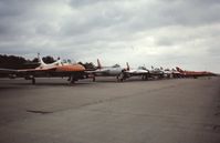 EGVI Airport - Line up of Hawker Hunters (including the prototype)
at IAT 76 held at RAF Greenham Common in July 1976. Celebrating 25 years since the first flight of the prototype on 20 July 1951. - by Roger Winser