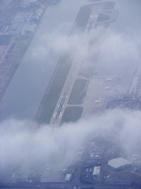 London City Airport, London, England United Kingdom (EGLC) - over London City airport on approach to Heathrow - by Chris Hall