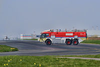 Liverpool John Lennon Airport - Liverpool Fire Service tender 1 on taxiway with light aircraft and airport terminal building in background.   - by Mark J Kopczewski