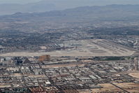 Mc Carran International Airport (LAS) - McCarran International/LAS, west of the airport, climbing through 6,000' heading 020 on the STAAV4 departure. - by Mark Kalfas