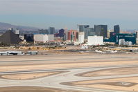 Mc Carran International Airport (LAS) - Las Vegas, McCarran International looking at the west/northwest side of the airport with the Strip in the background as seen on departure from RWY 25R. - by Mark Kalfas