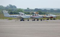 Swansea Airport, Swansea, Wales United Kingdom (EGFH) - Three of Cambrian Flying Club's Piper Tomahawk aircraft. - by Roger Winser