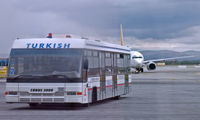 Ankara Esenbo?a International Airport - A Pegasus B737 in hot pursuit of a THY bus - by Murat Tanyel