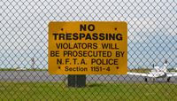 Buffalo Niagara International Airport (BUF) - A sign reading No Trespassing violators will be prosecuted by N.F.T.A Police. Section 1151-4 - by aeroplanepics0112