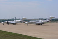 Fort Worth Alliance Airport (AFW) - Both of Textron's jets on the ramp in front of the Bell Helicopter Hanger - by Zane Adams