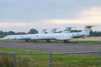 Cranfield Airport, Cranfield, England United Kingdom (EGTC) - bizjets parked at Cranfield with visitors for the opening of the London 2012 Olympic games. From L to R are B-8098, N450JR, N780W and B-8097 - by Chris Hall
