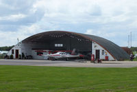 Denham Aerodrome Airport, Gerrards Cross, England United Kingdom (EGLD) - The old wartime blister hangar on the north side of the aerodrome - by Chris Hall