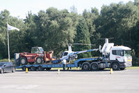 Blackbushe Airport - Removal of R22 display exhibit from airport entrance - by OldOlympic
