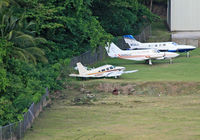George F. L. Charles Airport (formerly Vigie Airport) - Three abandoned aircraft are parked at a remote stand at George F. L. Charles Airport, Castries, St. Lucia; the one in the foreground once belonging to Bird of Paradise, the other two to General Aviation Services. - by Daniel L. Berek