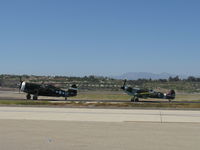 Camarillo Airport (CMA) - Real Thunderbolt N3395G and replica Spitfire N1940K taxi to 26 - by Doug Robertson