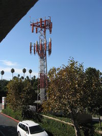 Oxnard Airport (OXR) - OXR's Airport Rotating Beacon (clear-green) with sector block to the OXR Air Traffic Control Tower, atop one of several antenna farms. Location: SE. Photo from off-airport. White-Red vertical antennas are cell phone repeaters. - by Doug Robertson