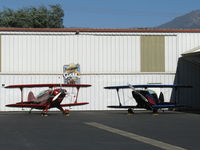 Santa Paula Airport (SZP) - N49BR Christen EAGLE Experimental class and N189PT Aerotek PITTS S-2A Production class aerobatic biplanes share a hangar - by Doug Robertson