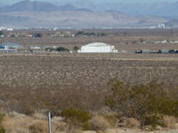 Inyokern Airport (IYK) - The large white building in the center of the picture is the Kodiak hanger at Inyokern. Supposedly named after a type of hanger first built in Alaska, this hanger was built by the U.S. Navy in 1943 when Inyokern was used for ordinance testing. - by Bo Shaw