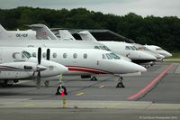 Geneva Cointrin International Airport - A line up of aircraft on the RUAG ramp - by Carl Byrne (Mervbhx)
