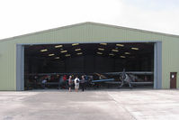 EGBR Airport - A hangar full of Buckers. Bucker Fest - Wings & Wheels, The Real Aeroplane Club, Breighton Airfield, July 14 2013. - by Malcolm Clarke