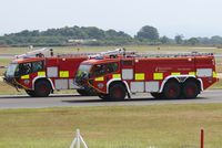 Manchester Airport, Manchester, England United Kingdom (EGCC) - Two of Manchester Airport's fire engines.  - by Graham Reeve