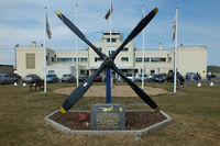 Shoreham Airport, Shoreham United Kingdom (EGKA) - Memorial featuring a Martin B-26 Marauder prop with the Grade II* listed art deco style Terminal  Building in the background - by Chris Hall