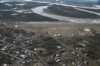 Fort Yukon Airport (FYU) - Fort Yukon, Alaska during breakup of the Yukon River prior to minor flooding of runway.  Taken from Wright Air N4637U piloted by Dave Lorring. - by David Lee