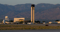 Albuquerque International Sunport Airport (ABQ) - The control tower at evening.  The tower controls both domestic and military operations as this airport is jointly used by Kirtland Air Force Base. - by Roland Penttila