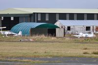 Swansea Airport, Swansea, Wales United Kingdom (EGFH) - Recently erected hangar to house Vans aircraft including two RV-8's of Team Raven formation aerobatic team. G-VFDS and G-EGRV can be seen outside the hangar. - by Roger Winser