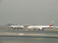 Dubai International Airport - 2x B-777 from Emirates - by Paul H