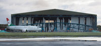 Bournemouth Airport, Bournemouth, England United Kingdom (EGHH) - Shredded curtain in the former BASCO hangar which was being extended. The storm the night before wreaked havoc with the curtain. - by Howard J Curtis