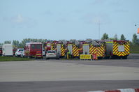 Norwich International Airport, Norwich, England United Kingdom (EGSH) - Fire engines lined up after a KLM 737 diverted to Norwich following a problem on a flight from Manchester to Amsterdam. - by Graham Reeve