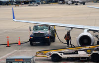Chicago O'hare International Airport (ORD) - Pumping fuel onto an aircraft O'Hare - by Ronald Barker