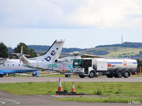 Dundee Airport, Dundee, Scotland United Kingdom (EGPN) - Refueling action at Dundee Riverside. Helicopter is visiting AW139 ZS-EOS with Flybe Dornier 328 G-BWWT in the rear. - by Clive Pattle