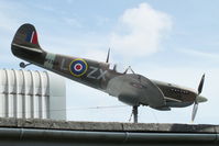 X2TG Airport - large scale model Spitfire on the roof of the Tangmere Military Aviation Museum - by Chris Hall