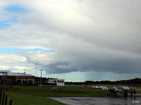 Fife Airport - Looking east across apron towards the clubhouse/restaurant and hangars - by Clive Pattle