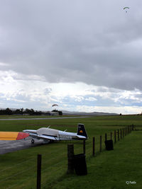Fife Airport - View looking west at Glenrothes EGPJ with parachutists landing - by Clive Pattle