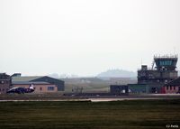 RAF Lossiemouth Airport, Lossiemouth, Scotland United Kingdom (EGQS) - Shot of the tower on a dull, misty and overcast morning at RAF Lossiemouth. A visiting Royal Navy Hawk T.1 sits awaiting its next sortie during the ongoing Exercise Joint Warrior 14-2 - by Clive Pattle