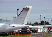 Dundee Airport, Dundee, Scotland United Kingdom (EGPN) - A view of the maintenance area at Dundee Riverside, with the tail of a Dornier 328 parked at the Loganair/Flybe engineering facility at the airport. - by Clive Pattle