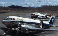 Port Moresby/Jackson International Airport, Port Moresby Papua New Guinea (AYPY) - A trio of Douglas DC-3's at Port Moresby Airport, each in a different color scheme. This was the transition period for the newly formed Air Nuigini. Photo taken December 1974 - by Peter Lea