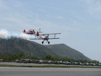 Santa Paula Airport (SZP) - Aviation Museum of Santa Paula 1st Sunday display day, N66711 and N65124 with smoke in echelon making fast low pass over Rwy 22 - by Doug Robertson