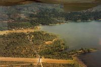 Gravelly Valley Airport (1Q5) - This picture shows the road that crosses the south end of runway.While there are stop signs,vehicles do not always stop.Landing, a pilot should be prepared for this!!Seen more then one pilot startled when a car appeared when landing. - by S B J