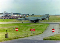 RAF Leuchars - Posted to primarily show a shot of the crowd line at a Leuchars Airshow. A sight that will be seen no more with the imminent closure as an airbase approaching fast (Mar '15). Taken at the 1996 airshow as a Luftwaffe Phantom F4F taxies in after a display. - by Clive Pattle