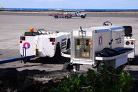 Kona International At Keahole Airport (KOA) - If the Ground Power Unit is a TUG,then what is the vehicle towing it,and the one beside it?? - by metricbolt