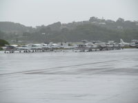 Gold Coast Airport - general aviation ramp in torrential rain - by magnaman
