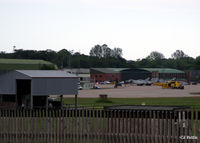RAF Leuchars - A long distance shot of the ramp showing Typhoons and a Seaking - by Clive Pattle