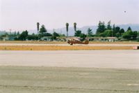 Watsonville Municipal Airport (WVI) - Aeronca L3 and Cessna 210.If it is a  race, my money is on the 210, but off frist ??? Both in position for departure from the Watsonville Flyin in Calif. - by S B J
