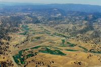 NONE Airport - Large cattle ranch strip near Patterson,Ca.till it was sold for development of high end homes.The paved runway is seen on the left where the road turns right.Flew over it many times but never landed. View is to the west. - by S B J