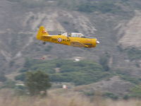 Santa Paula Airport (SZP) - Condor Squadron high speed flour bomb run at riverbed target, Commemorating 7 Dec. 1941 attack on Pearl Harbor. Bombardier always operating from back seat, making multiple passes/drops.  - by Doug Robertson